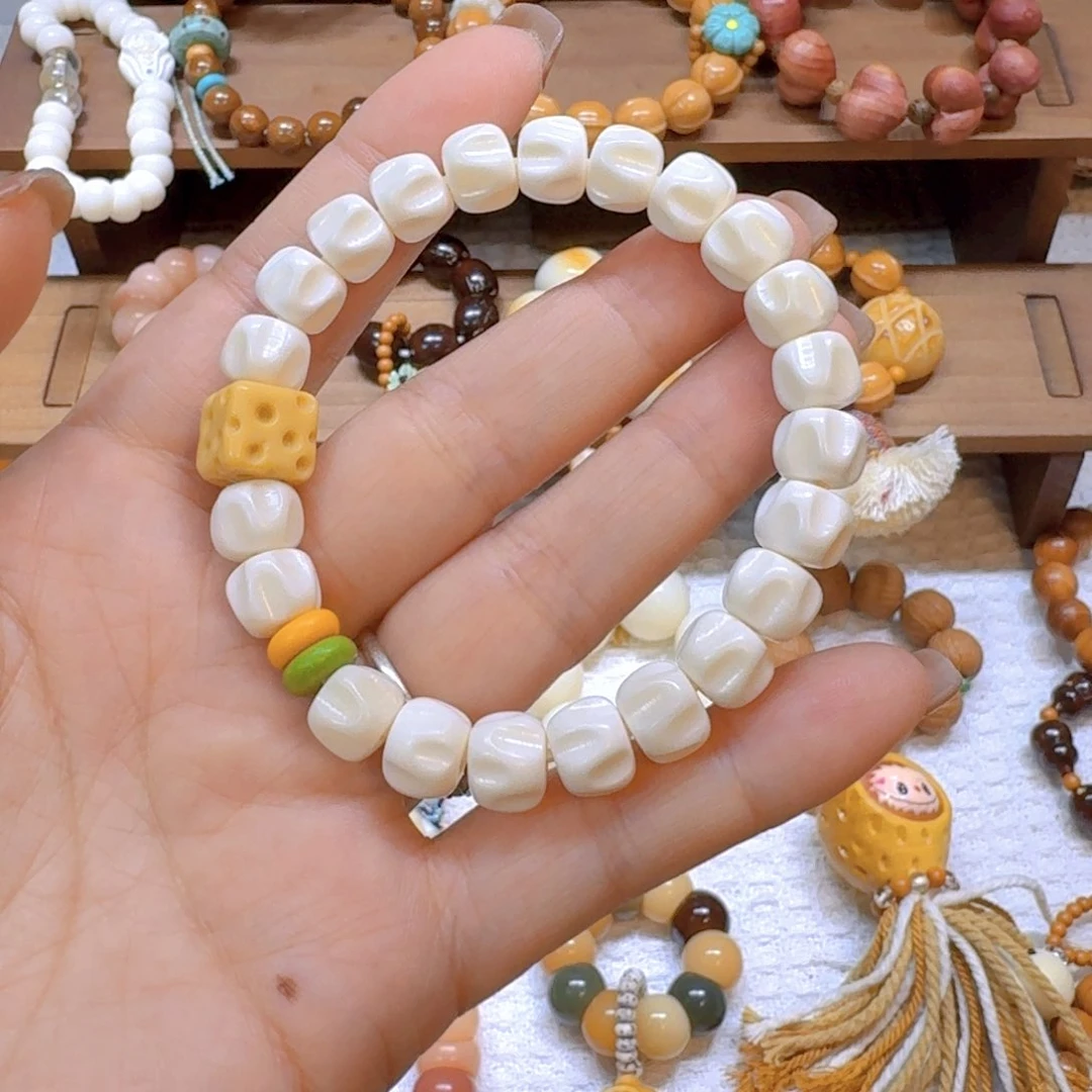 星月菩提吊坠牛骨百香籽10mm金膏