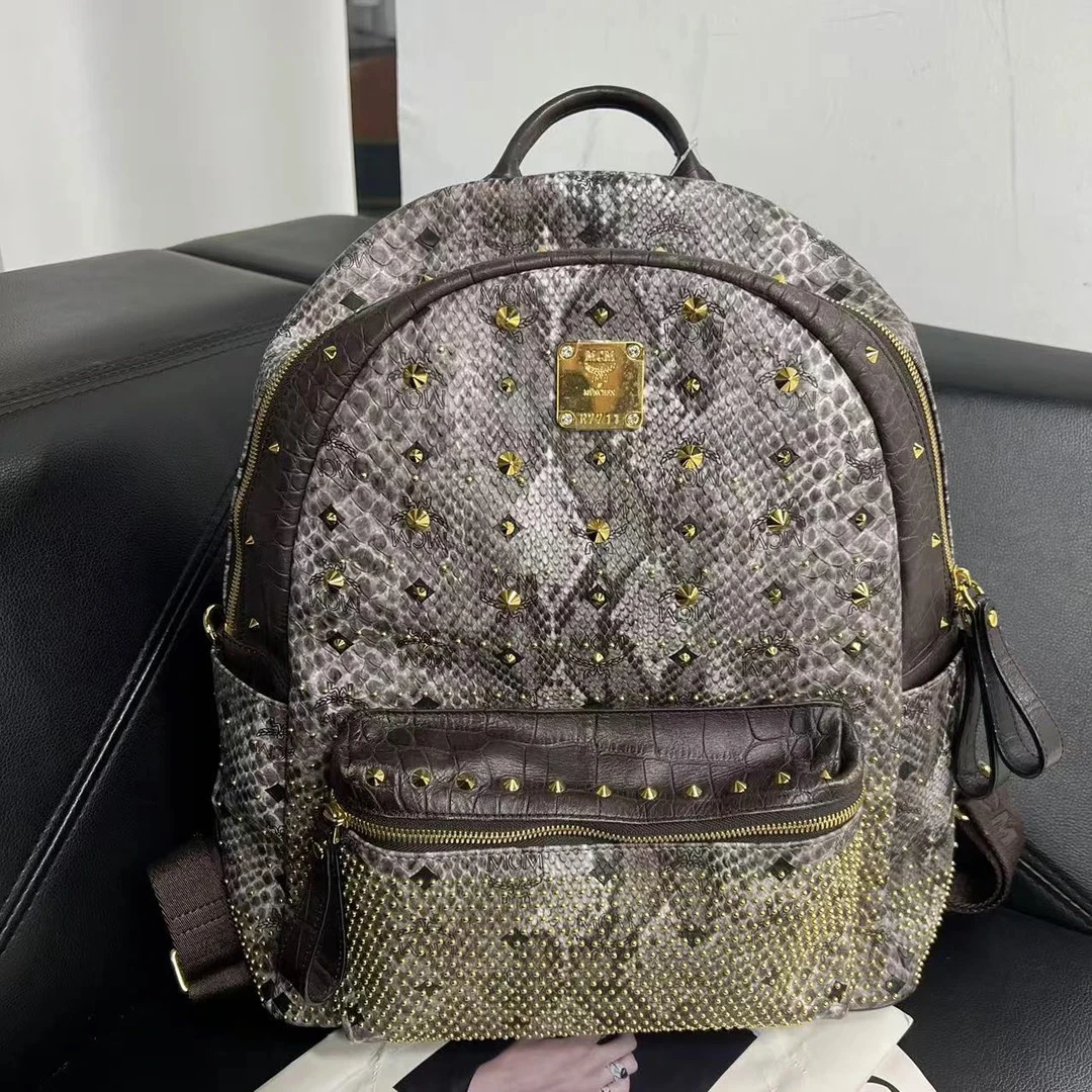 95新 MCM 捐金沉珠/双肩包