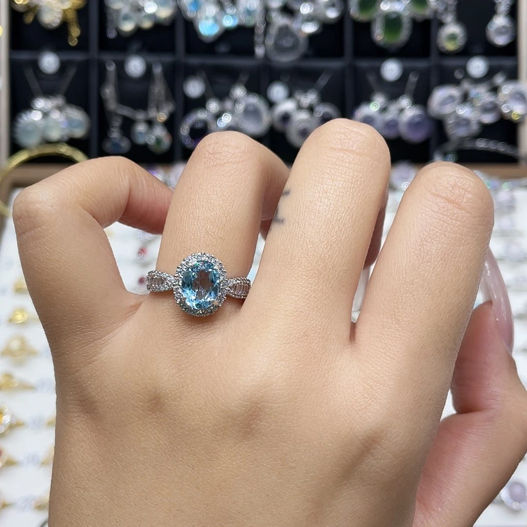 弹***左银S925镶嵌托帕石戒指