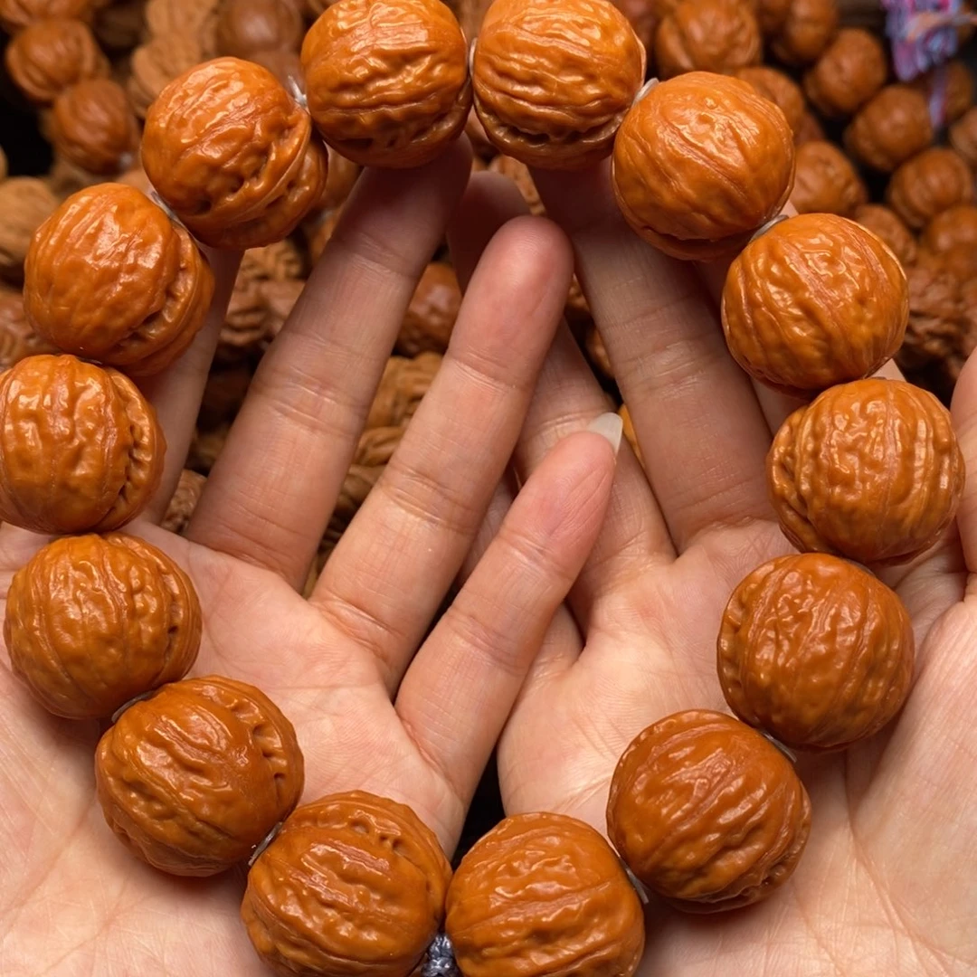 桃核手串大光头，