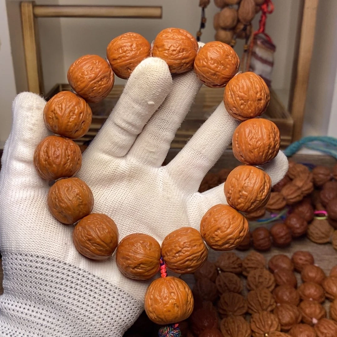 卷***卷文玩核桃吊坠荔枝纹元宝手持