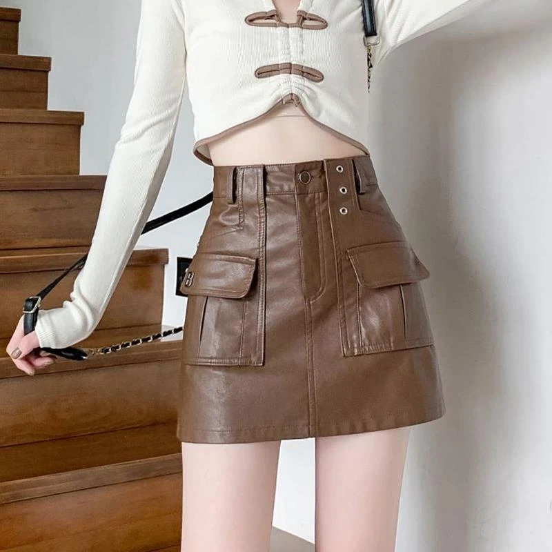 美式工装皮裙女辣妹包臀半身裙秋冬设计感咖色PU皮高腰a字短裙子