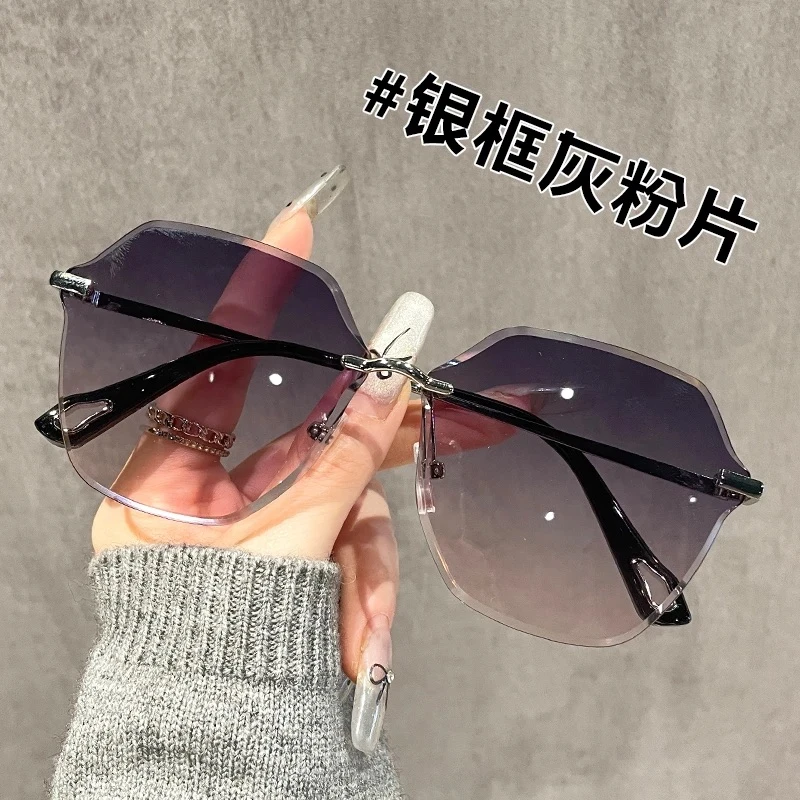 时尚气质女士太阳眼镜网红时尚百搭防紫外线无框渐变灰粉墨镜女潮