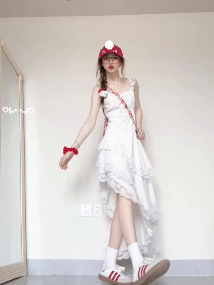 海边度假风白色吊带连衣裙2025春夏款漂亮独特不规则沙滩气质长裙