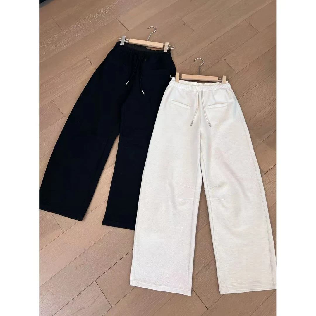 JOJO/玖了个玖 2025早春 立体剪裁窄版发泡肌理弯刀休闲裤2501C85