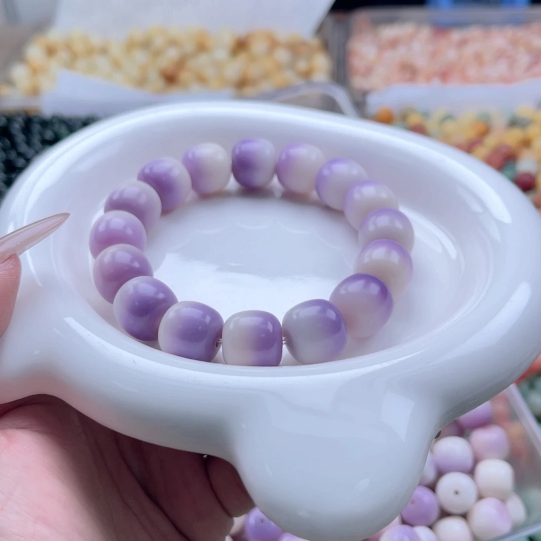 白玉菩提吊坠c14.5mm35颗。紫飘干磨石头料