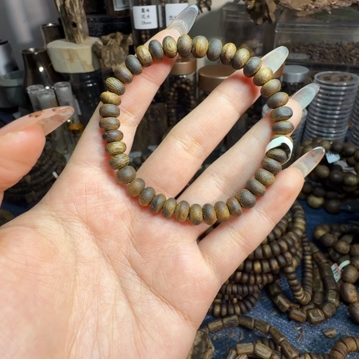 与***胜沉香碎屑沉香07虫漏算盘珠单圈海南老料