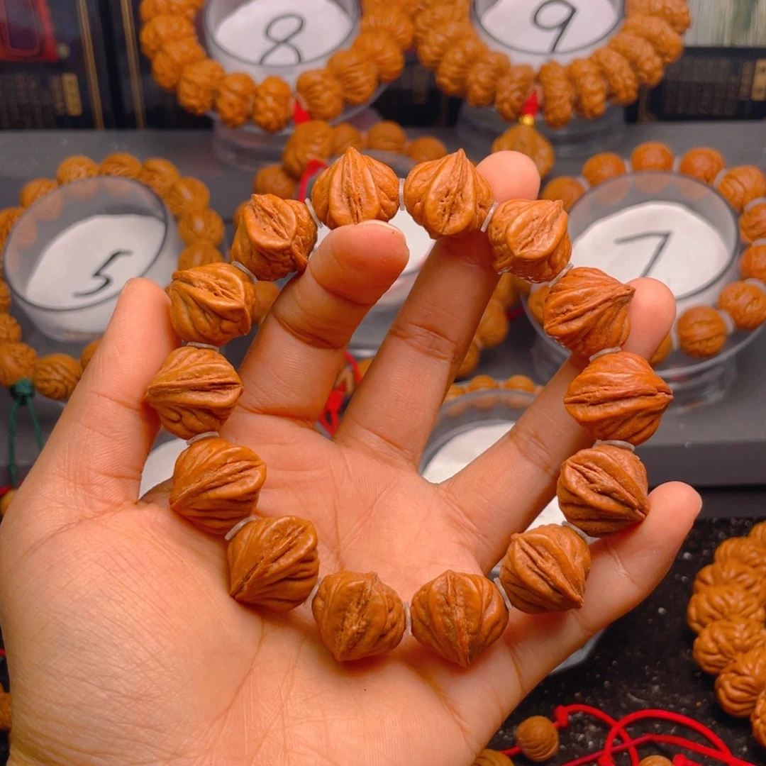 桃核手串生命之源之扭转乾坤腰缠万贯