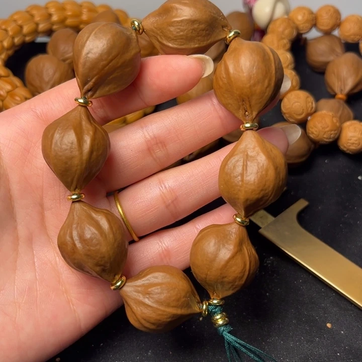 福***昆橄榄核吊坠梅林铁盒