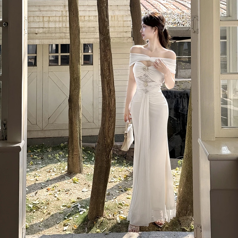 度假风一字肩网纱连衣裙女夏季新款礼服裙性感镂空杏色修身裙子