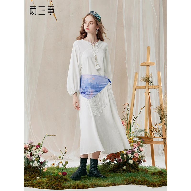 两三事 弦月霞光 时尚印花流苏腰封灯笼袖连衣裙S25QLY147