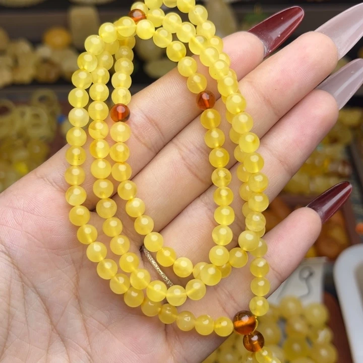 蜜蜡未镶嵌珠宝奇石鸡油黄满蜡妖花108颗卡5+ 微微瑕