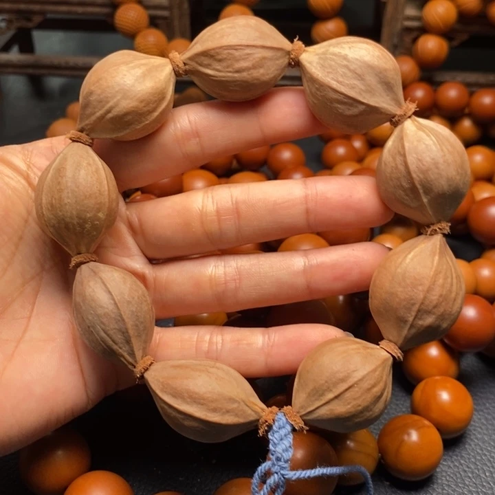 橄榄核手串2.3尺寸原皮四花