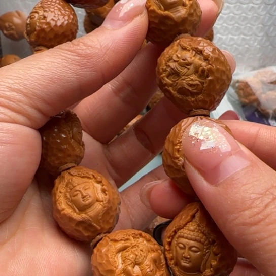 揽***星吊坠桃核橄榄雕工艺品