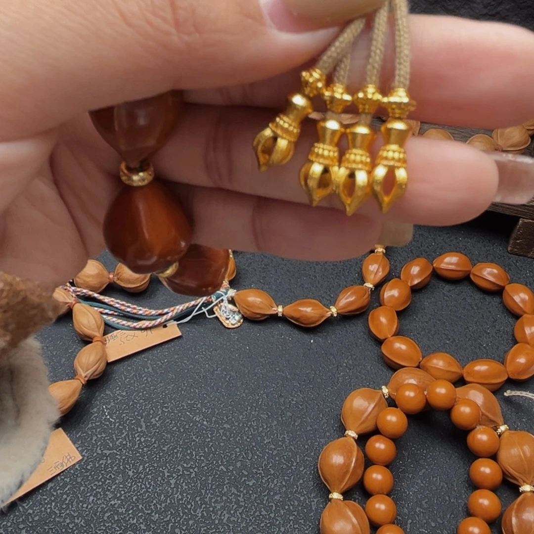 朝***拾手串橄榄核1.5弟子珠4个