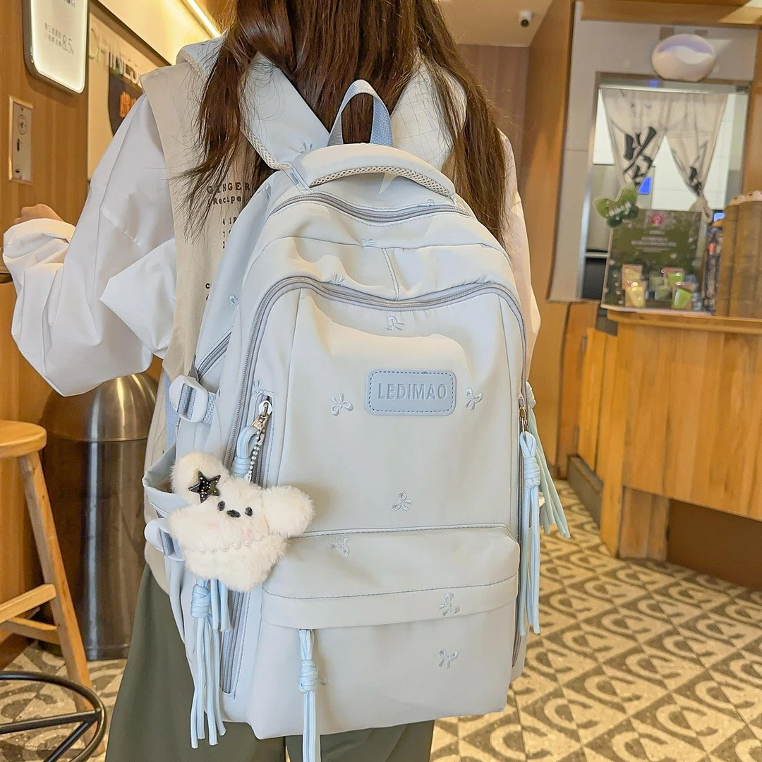 儿童书包女生小学生2025新款大容量初中生高中生多层轻便双肩背包