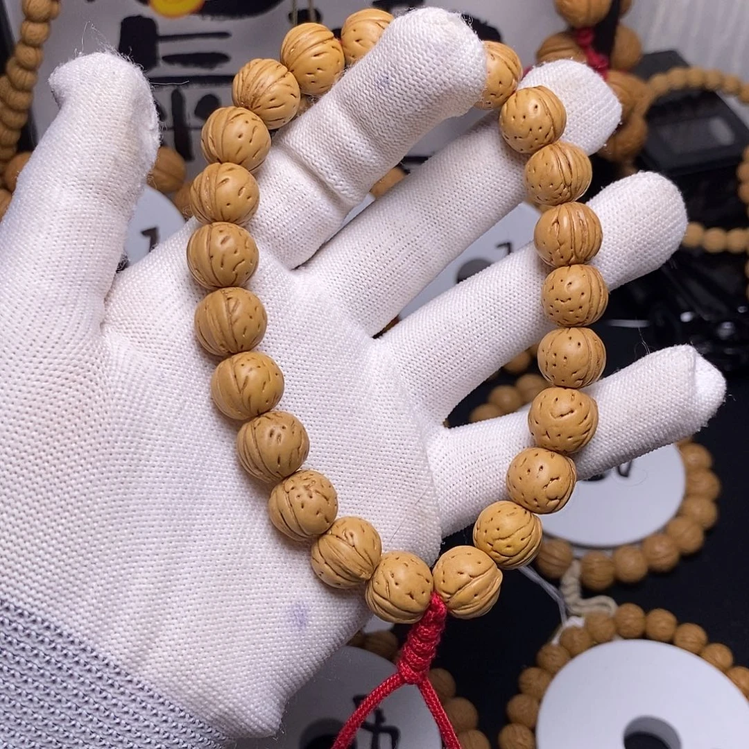 吊坠桃核光头肌肉手持