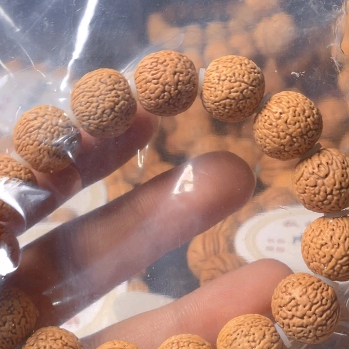 桃核吊坠晨****昏蚂蚁手串