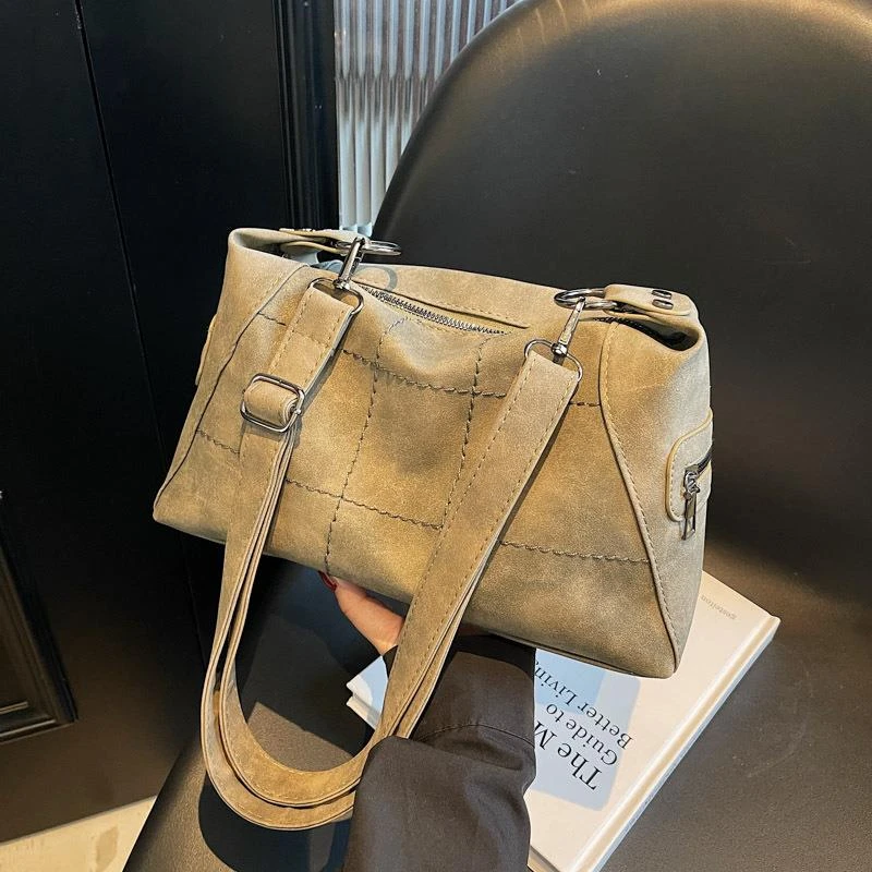 大容量包包女2025春季新款小众设计复古单肩斜挎包上课通勤饺子包