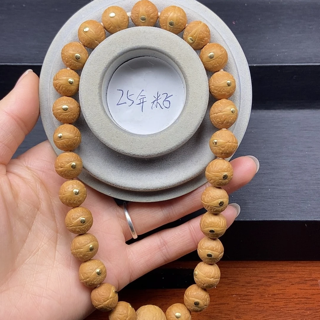 手串凤眼菩提12.5➕铜手持，25年籽