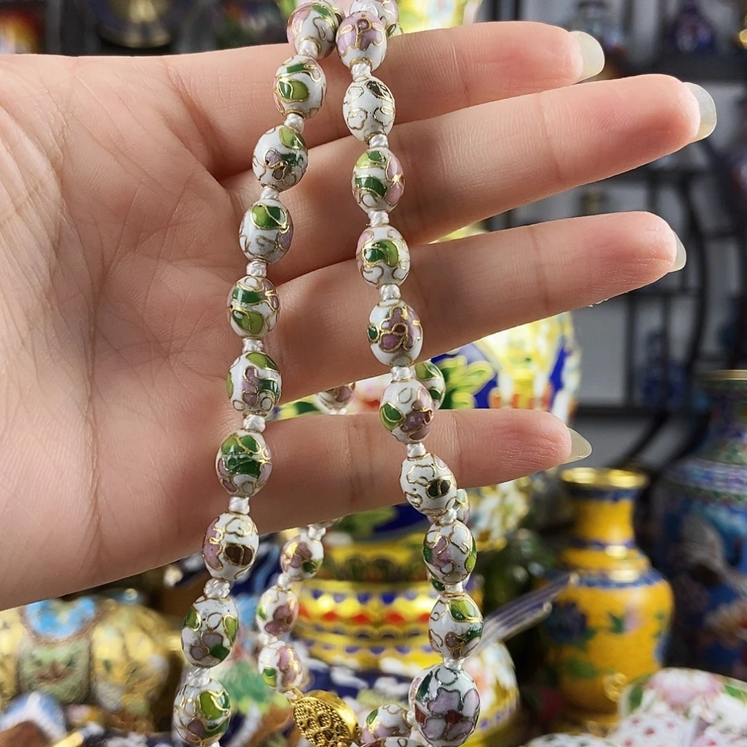 荣***誉铜白色异形枣珠链
