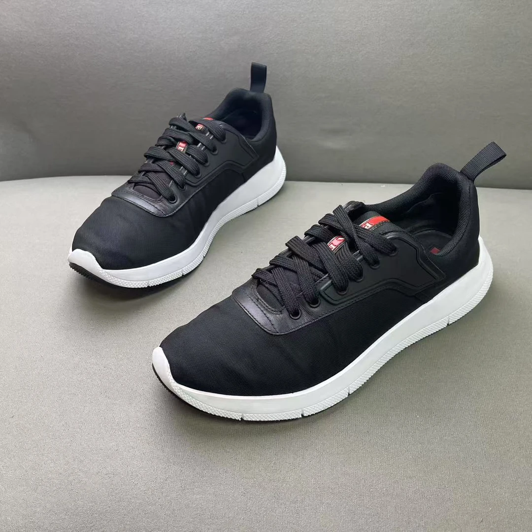 95新 Prada/普拉达 黑面白底网面红标logo时尚百搭运动鞋 41.5码
