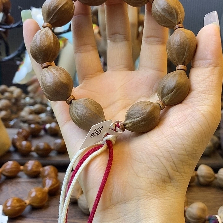 昕***昕吊坠橄榄核梅林铁核