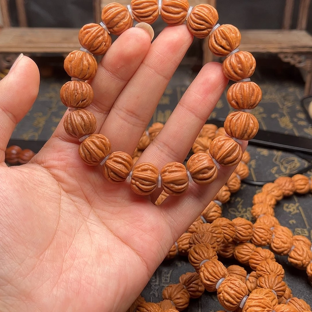 桃核吊坠佛手手串