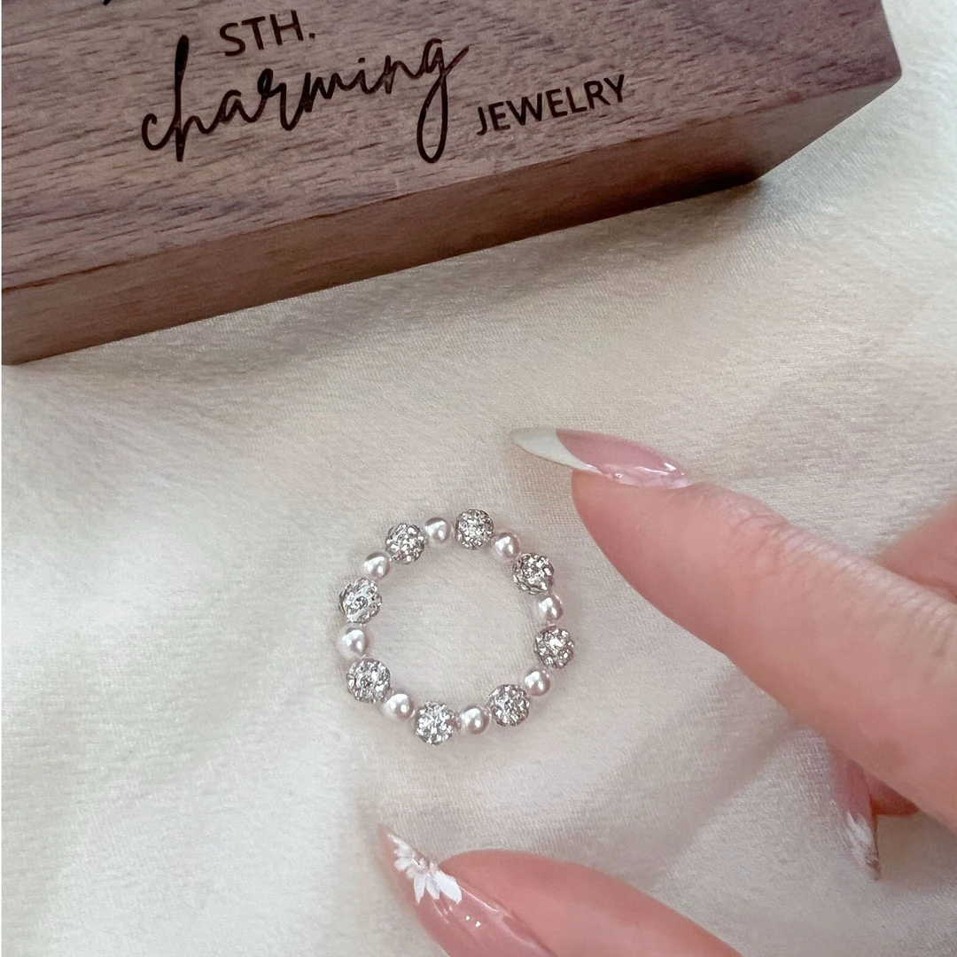 非金属合成锆石戒指 曼塔玫瑰粉珍珠戒 新款超闪锆石球弹力绳戒指