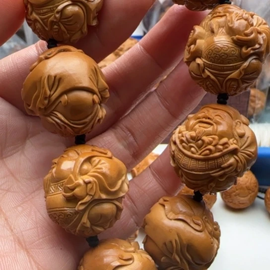 橄榄核手串哈****0雕刻工艺