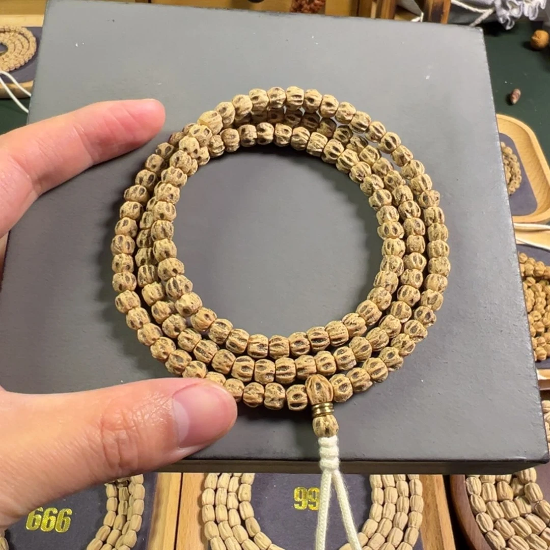 【闪购商品】柏香籽/百香籽吊坠咚*锵双坑对眼狮驼林