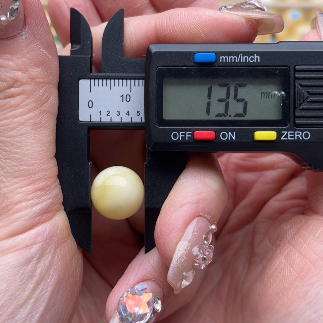 乐***哥琥珀未镶嵌裸石蜜蜡微瑕圆珠鸽