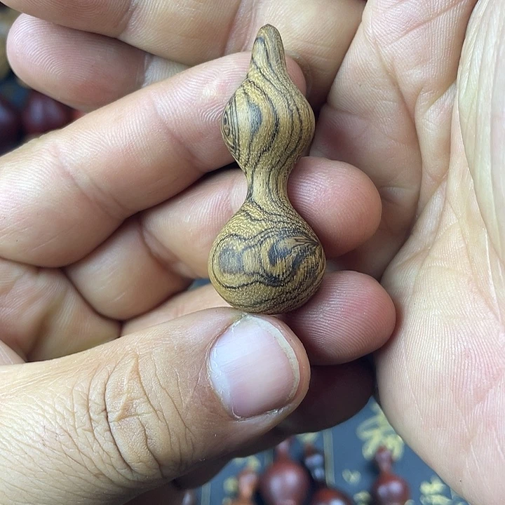 鳕***鱼破布木（黄金檀）手把件葫芦