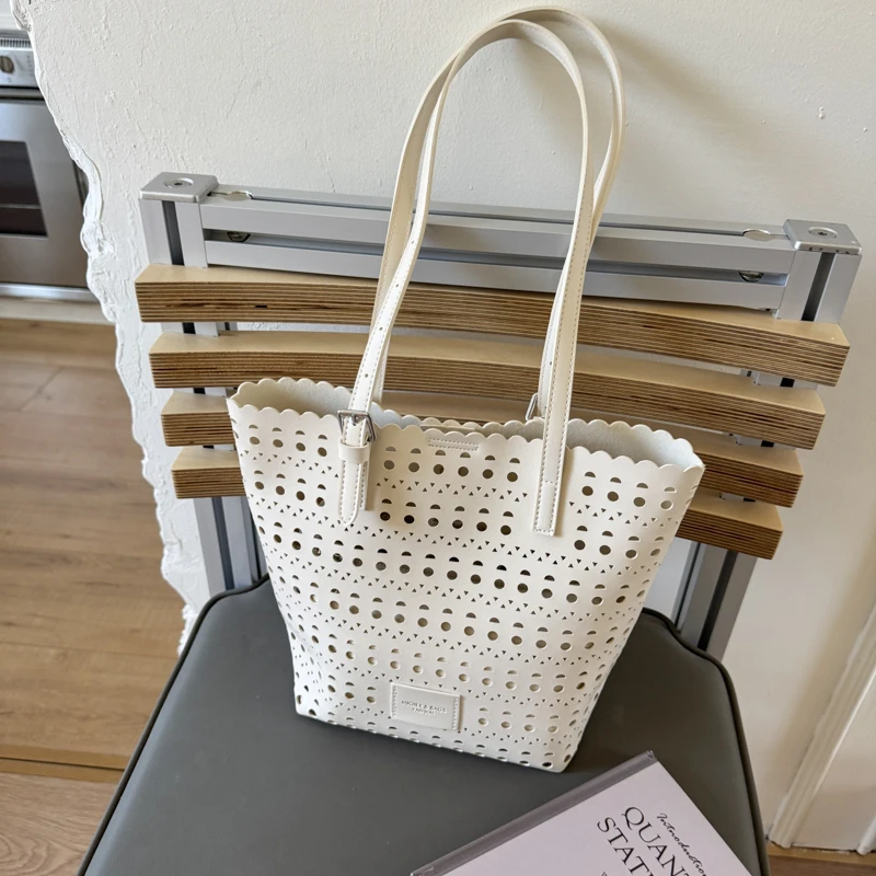 韩系简约小众水桶包镂空编织单肩通勤女新款休闲大容量气质斜挎包