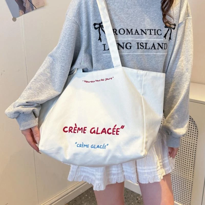 休闲软面大容量牛仔布包包女2025新款通勤单肩包帆布托特包水桶包