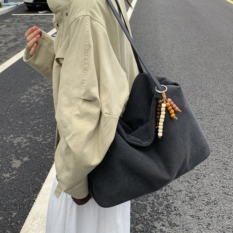 帆布包女2025新款潮时尚百搭学生上课通勤单肩包简约大容量托特包