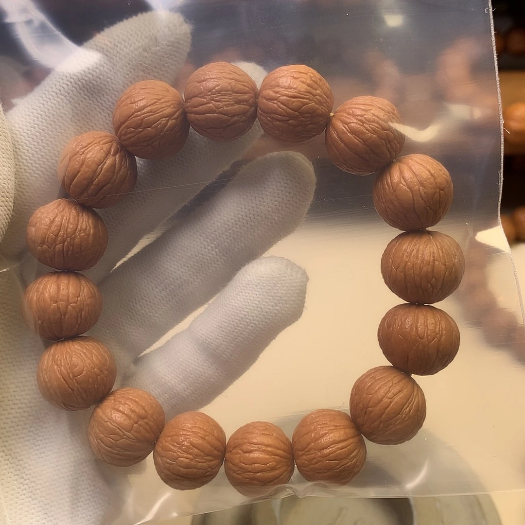 小***）吊坠猴头核桃16凤羽手串