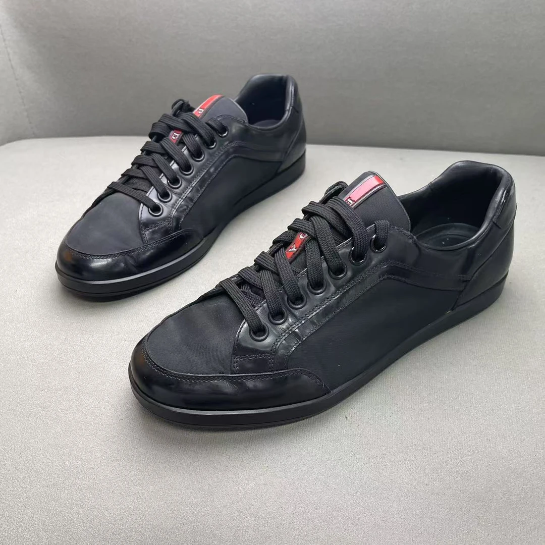 95新 Prada/普拉达 黑色网面鞋舌红标logo时尚百搭板鞋42码