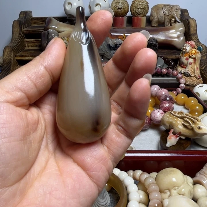 唐***胖石英石铁合金茄子手把件