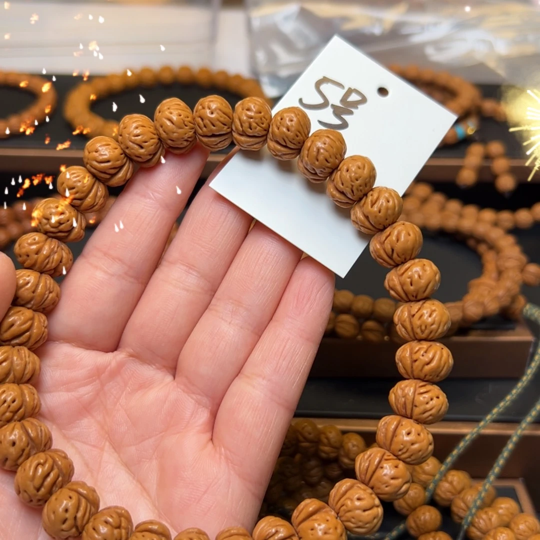 淘***贸文玩核桃把件秦岭龙纹桃核14蟠桃手持