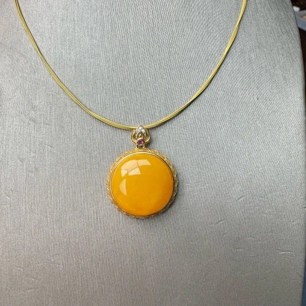 假一赔十天然琥珀蜜蜡鸡油黄蛋面S925银镶嵌吊坠 22*8mm 编号335