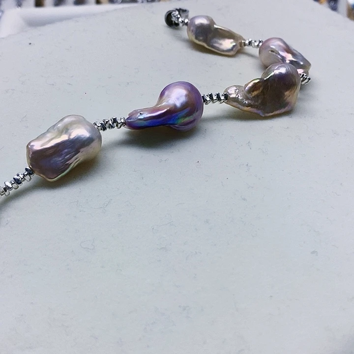 银S925镶嵌耳饰淡水珍珠阿****狗