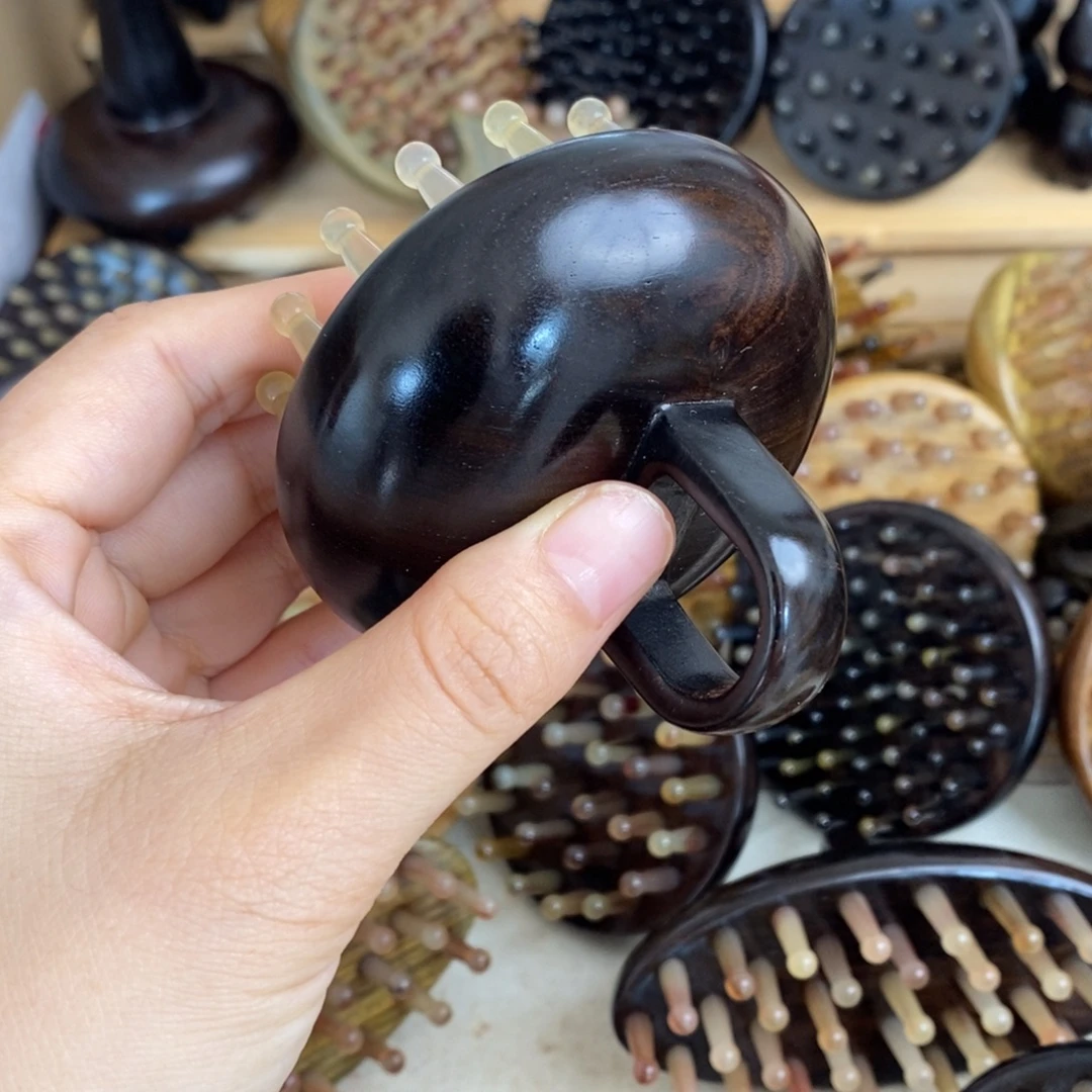 瑕疵紫光檀按摩梳子