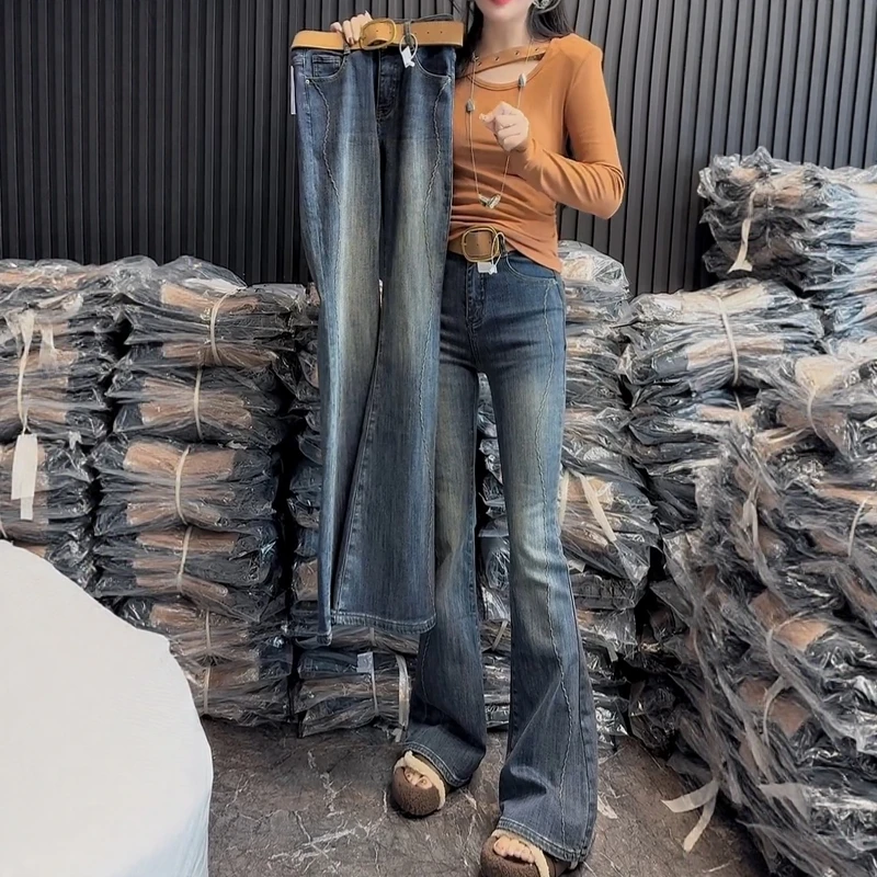 秋冬新款加绒加厚线条设计感修身牛仔微喇裤大码女装显瘦喇叭裤子