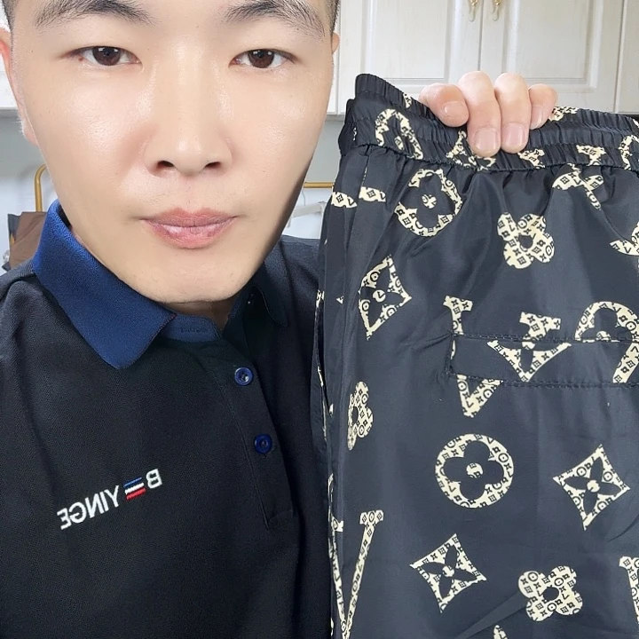 晓****3x驴花黑短裤时尚