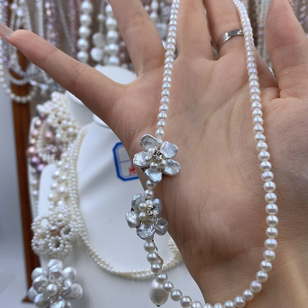 哎***糊项链耳饰淡水珍珠银S925镶嵌