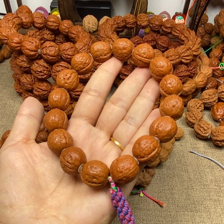 文玩核桃吊坠妙**花光头手串