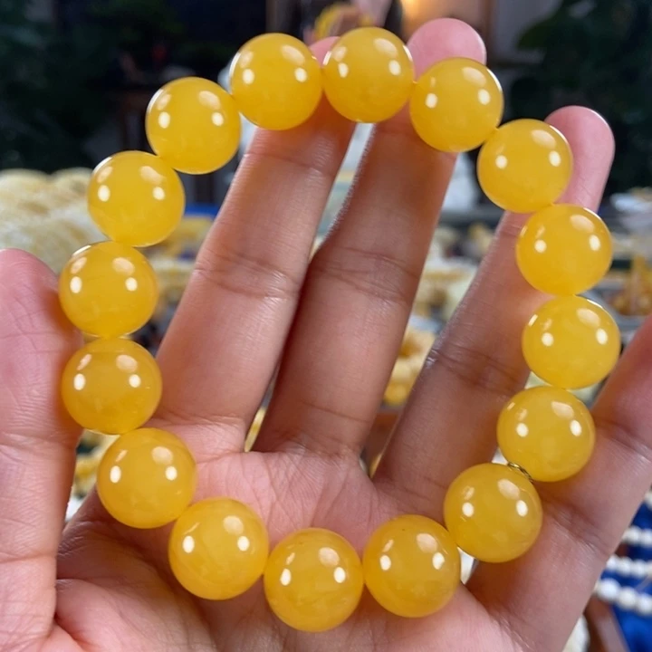 琥珀未镶嵌珠宝奇石14同料鸡油红圆珠26.35