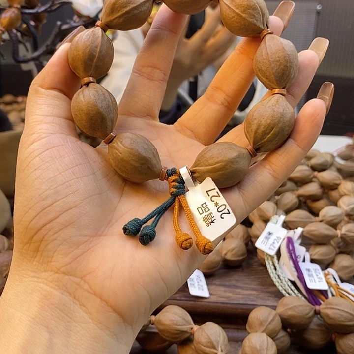 扬***吊坠橄榄核梅林铁核