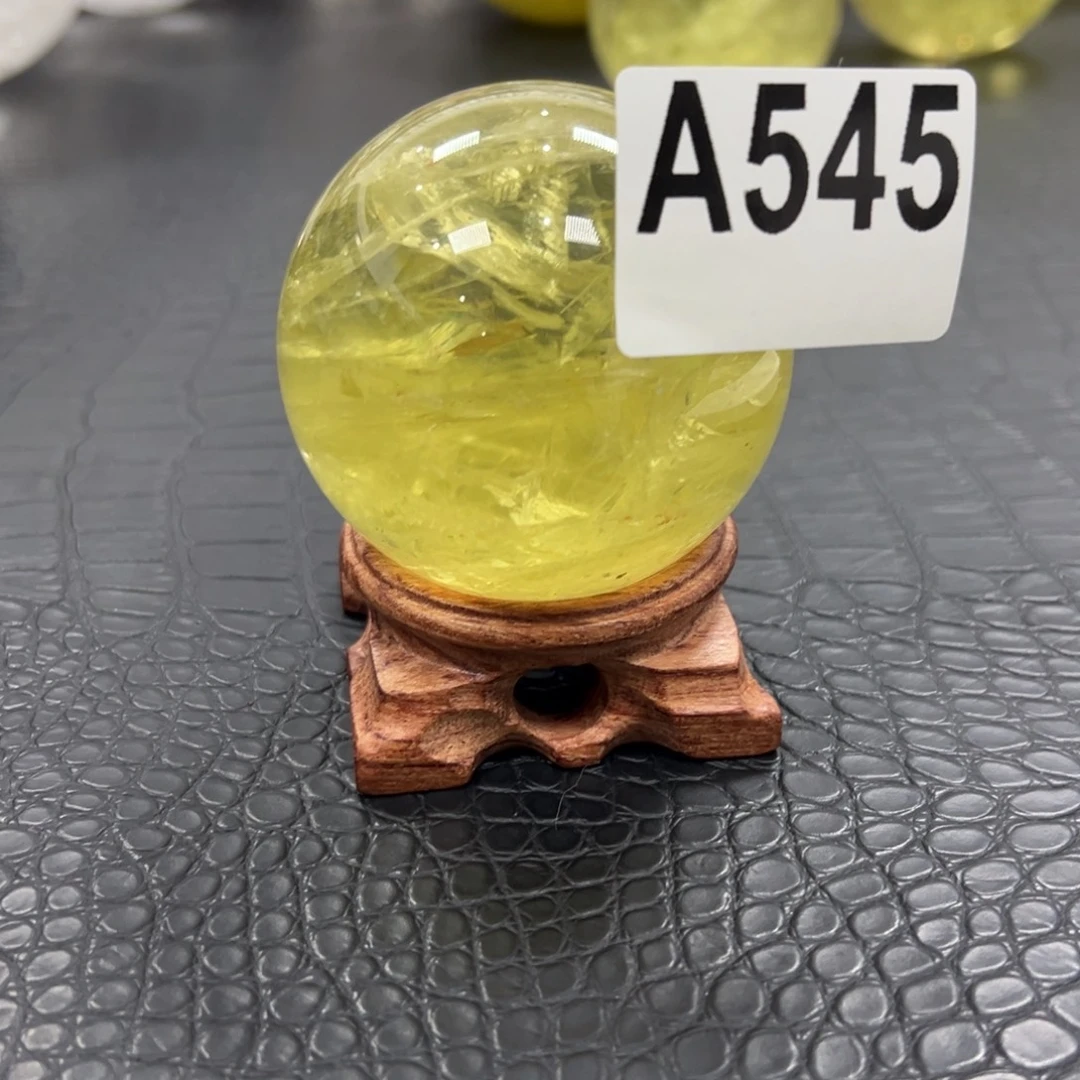 善***羊石材天然黄水晶球6.6